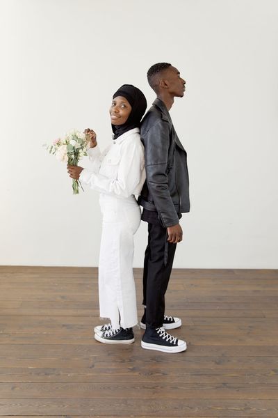 A man standing in a balanced pose, side view.